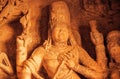 Face of Vishnu Lord in sculpture with many details on wall of old relief. Ancient Indian architecture in Badami, India Royalty Free Stock Photo