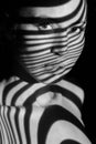 The face of woman with black and white zebra Royalty Free Stock Photo