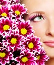 face of woman with chrysanthemum