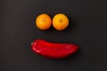 Face with yellow tangerine eyes and red pepper mouth Royalty Free Stock Photo