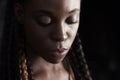 Face of young afro-american braided woman