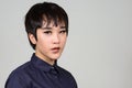 Face of young androgynous Asian transgender woman