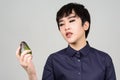 Face of young androgynous Asian transgender woman