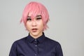 Face of young androgynous Asian transgender woman