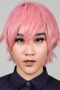 Face of young androgynous Asian transgender woman