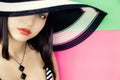 Face of young beautiful brunette in a summer hat Royalty Free Stock Photo