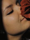 Face of a young girl in profile with a red rose stained glass effect Royalty Free Stock Photo