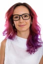 Face of young beautiful woman with pink hair and wearing eyeglas