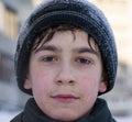 Face of young caucasian boy in winter walking cold weather siberian winter