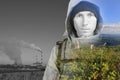 Face of young man hiker, steaming industrial smokestacks and green natural landscape. Double exposure effect photography