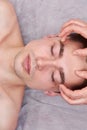 Face of young man, massage. Royalty Free Stock Photo