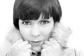 The face of young pretty woman with fur collar in black and white Royalty Free Stock Photo