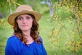 Face young woman in a blue dress on a willow background Royalty Free Stock Photo