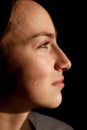 Face of young woman with tear drop close up