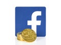Facebook icon placed with cryptocurrency coins