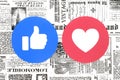 Facebook Like and Love buttons of Empathetic Emoji Reactions on newspaper