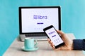 Facebook& x27;s Libra Crypto Digital Currency App on Smartphone and Laptop