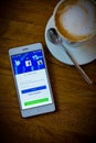 Facebook social media network on smart phone and coffee time