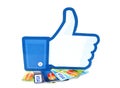 Facebook thumbs up sign printed on paper and placed on cards Visa and MasterCard on white background