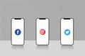 Facebook twitter instagram logo in three mobile screens