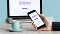 Facebook& x27;s Libra Crypto Digital Currency App on Smartphone and Laptop