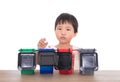 Faced with four different sorting trash bin models, children are learning trash sorting