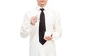 Faceless businessman in shirt with tie calmly holds broken cup.