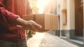 Faceless delivery man holding cardbox parcel box blurred street background. Generative ai Royalty Free Stock Photo