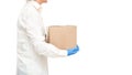 Faceless deliveryman hands in sterile gloves courier for safe delivery.