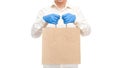 Faceless deliveryman hold in hands in sterile gloves of courier for safe delivery.