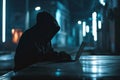 Faceless hacker in a dark hoodie