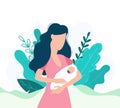 Faceless mother carefully holding newborn in arms