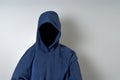 Faceless Person in Blue Hoodie