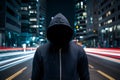Faceless thief in hoodie standing at night in front of city Royalty Free Stock Photo