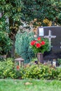 Facemask lying on grave of family members with a facemask during the pandemic