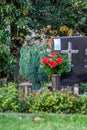 Facemask lying on grave of family members with a facemask during the pandemic