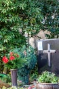 Facemask lying on grave of family members with a facemask during the pandemic