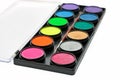 Facepaint palette and brush over white background Royalty Free Stock Photo