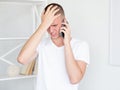 facepalm gesture shamed man mobile communication Royalty Free Stock Photo