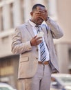 Facepalm, phone and city with a business black man in shock after reading a text message outdoor during his commute
