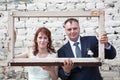 Faces of bride and groom in portrait frame