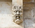 Faces carved into the Pont Saint Michel bridge in Paris, France