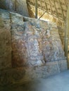 Faces carved in stone on two levels in Mayan ruins Royalty Free Stock Photo