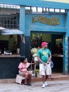 Faces Of Cuba-Man And Woman In Doorway Of Shop