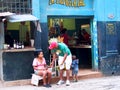 Faces Of Cuba-Man And Woman In Doorway Of Shop