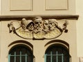 Faces engraved as decoration in an ancient building of Prague in Czech Republic