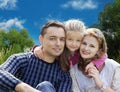 Faces family with little girl in summer park Royalty Free Stock Photo