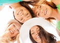 Faces of girls looking down and smiling Royalty Free Stock Photo