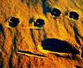 Faces in the sand Royalty Free Stock Photo