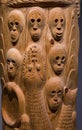 Faces and Snake Carved on Tree